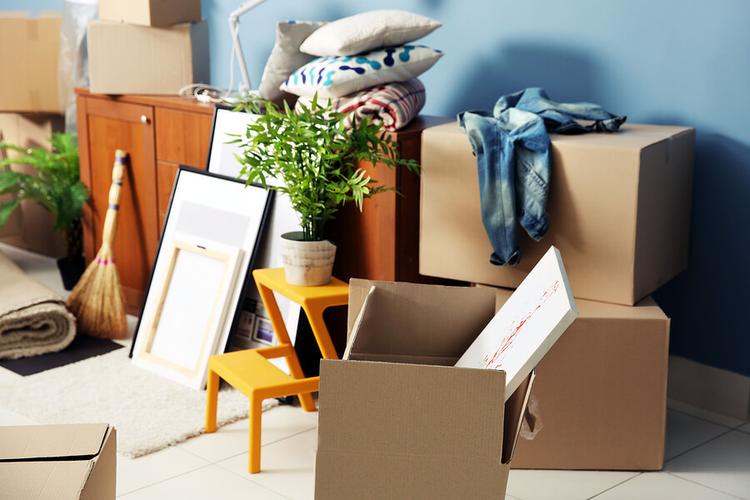 A neat stack of boxes and objects packed and ready for the removalists